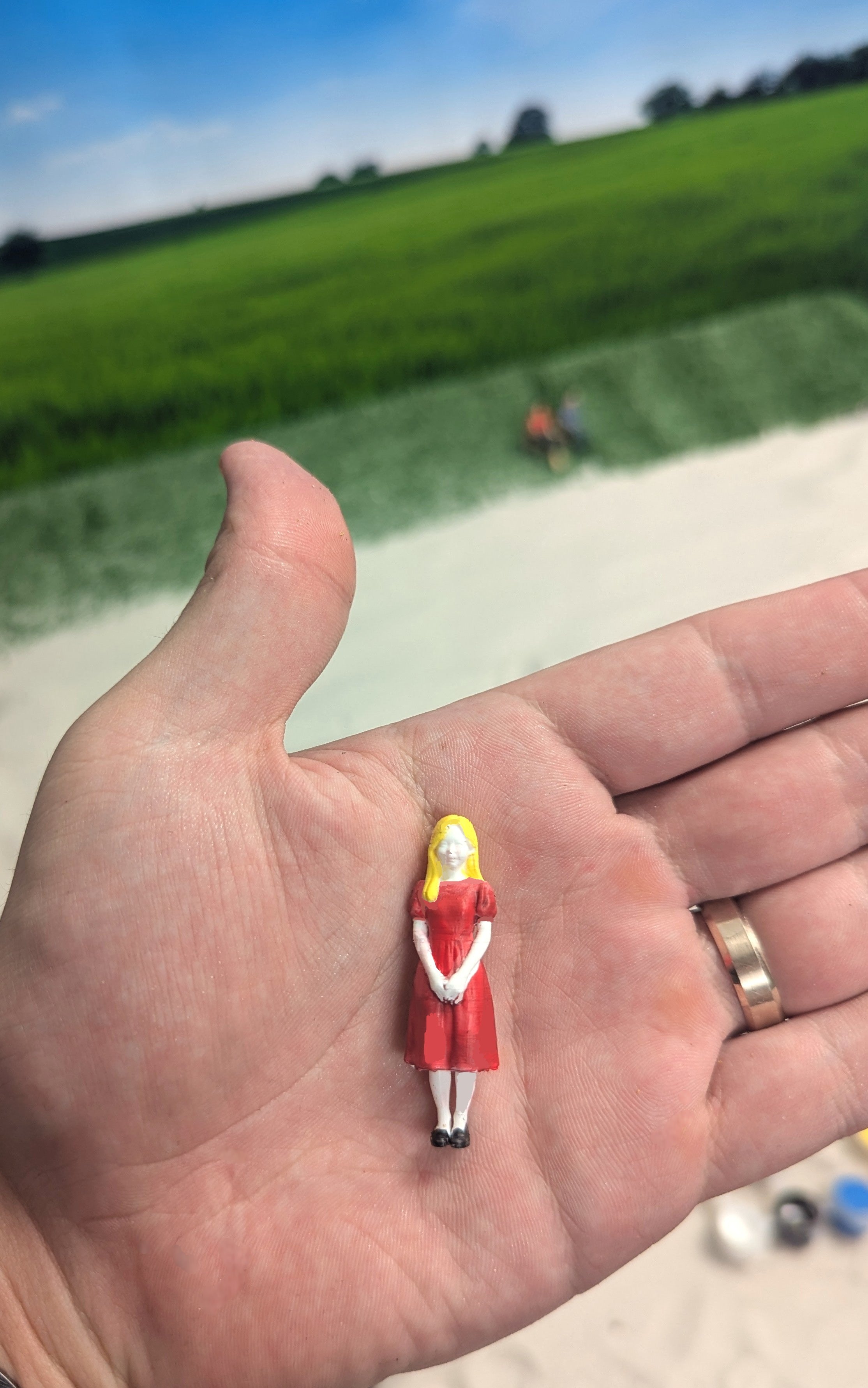 DIY miniature hand-painted human girl figure in hand