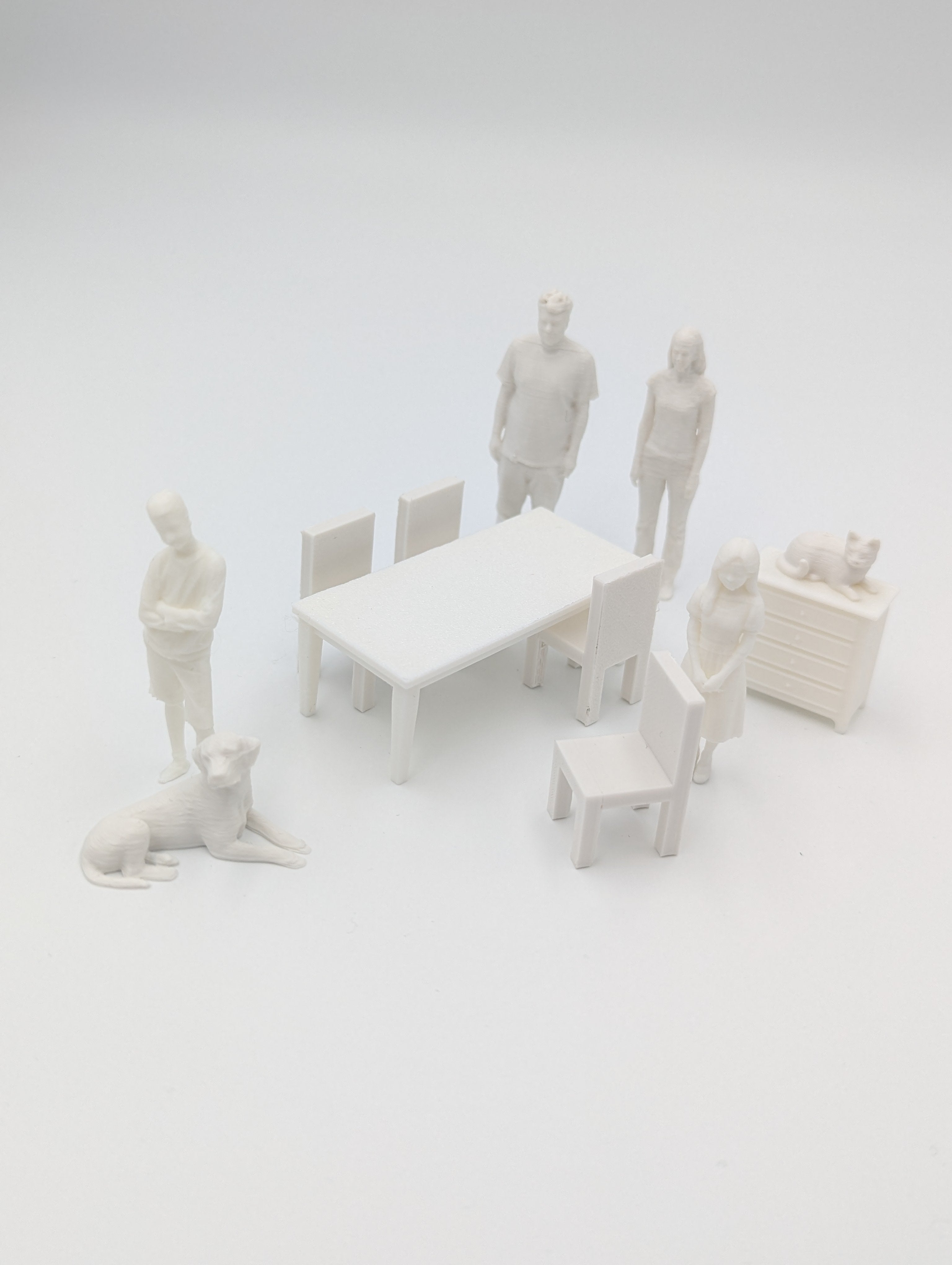 Paintable miniature family and animal figures with furniture for DIY house kits